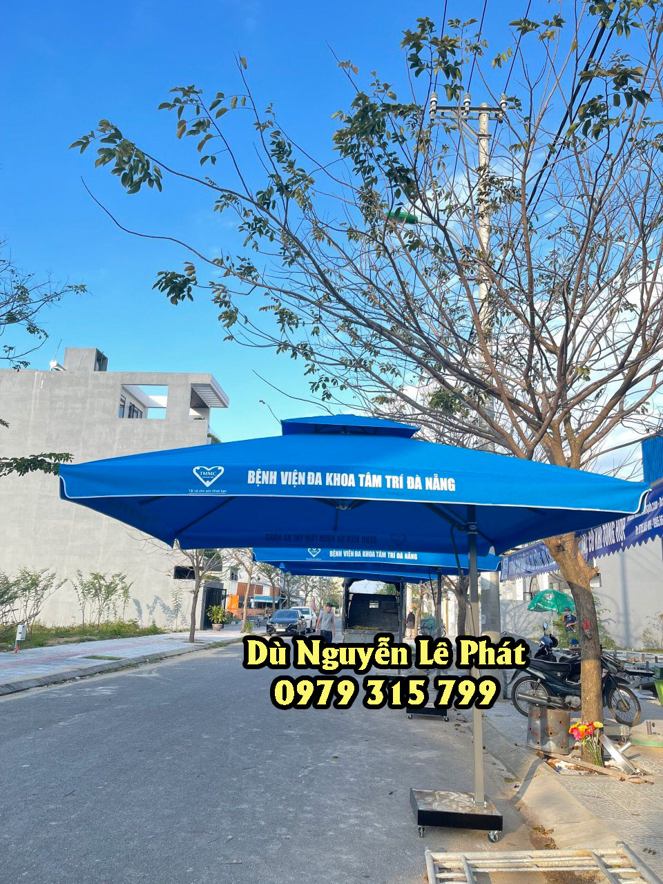 Thay vải bạt áo dù che nắng mưa